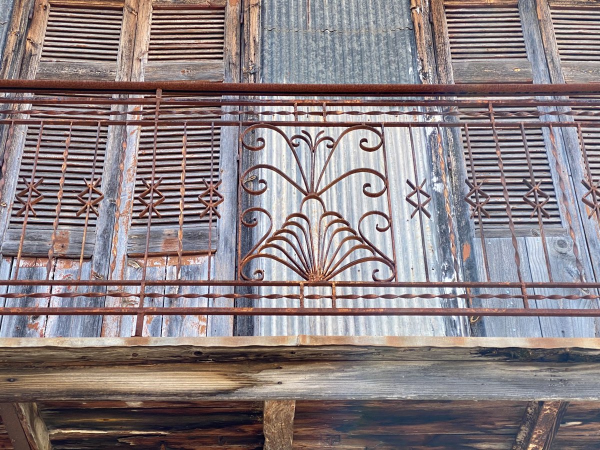 Elaborated forged iron railings with highly ornamental elements are found on many balconies. Photo by Andreas Thermos