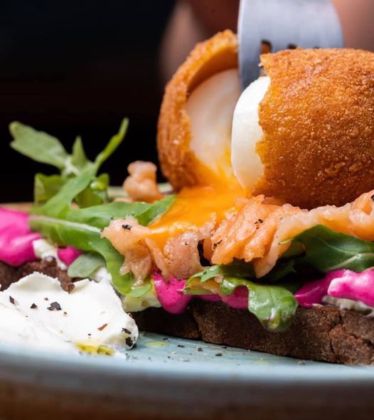 Karma Café. Salmon on bauernbrot with beetroot mayo, cream cheese, rocket and eggs pané. Yummy!